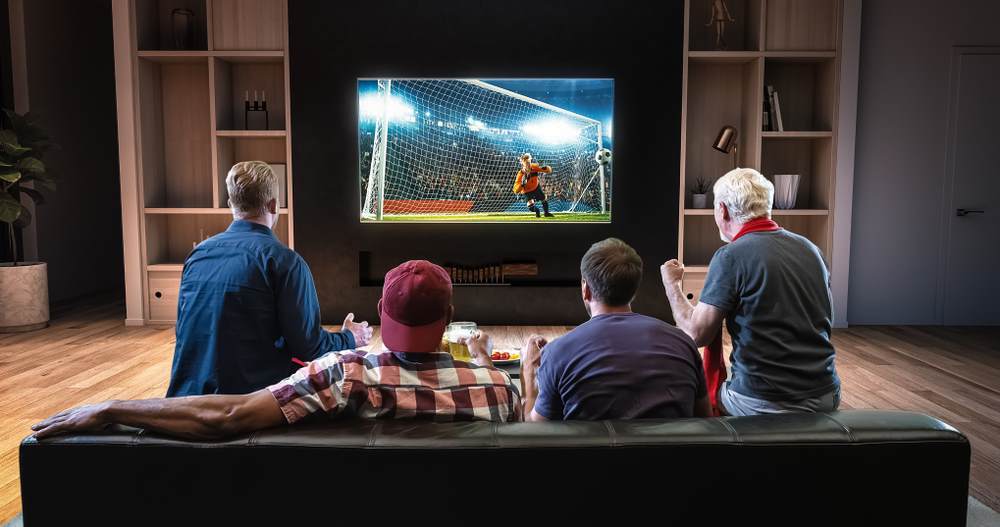 Men watching soccer on television